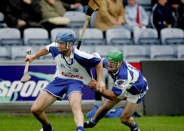 Waterford's Michael Walsh is held back by Damian Culleton of Laois