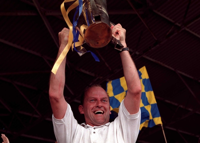 Ger Loughnane with the Liam McCarthy Cup draped in Clare colours
