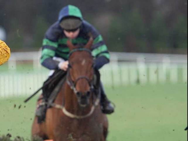 Al Eile achieved a hat trick of Aintree Hurdle wins on Grand National Day