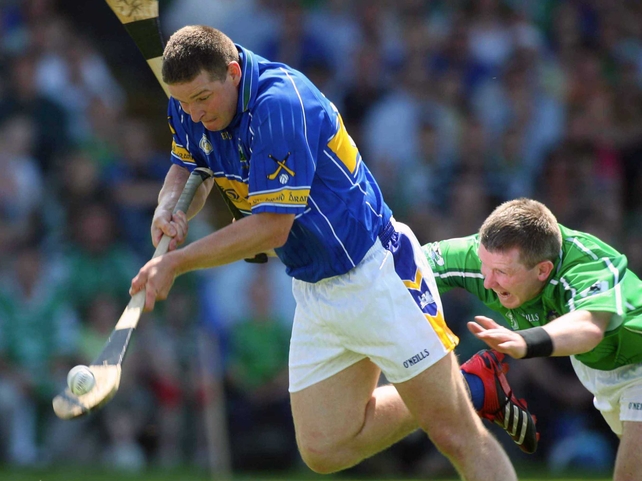 Tipperary's John Carroll evades a tackle from Limerick's Mark Foley to score the opening goal