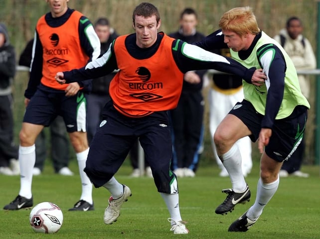 Stephen Elliott holds off Paul McShane during an Ireland training session