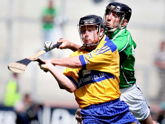 Clare's Niall Gilligan is pursued by Limerick's Donal O'Grady