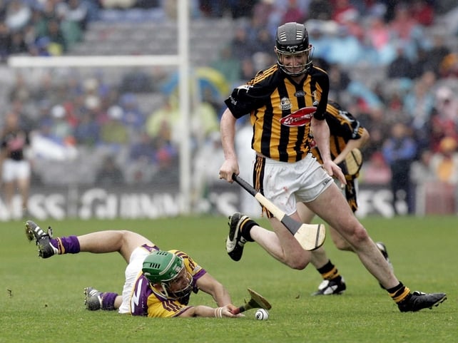 Kilkenny's Martin Comerford skips away from a grounded Keith Rossiter