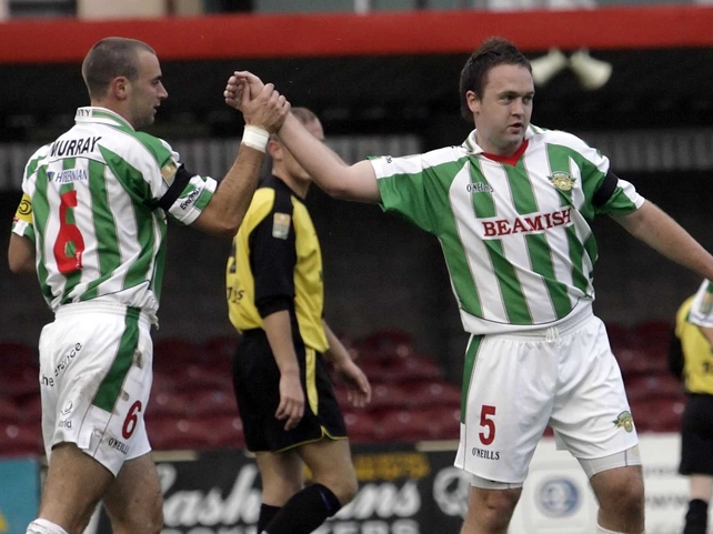 Dan Murray congratulates Brian O'Callaghan on scoring Cork's first goal