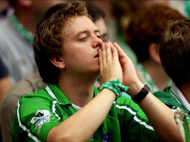 A Limerick fan watches as the match ebbs away from his side in the dying minutes