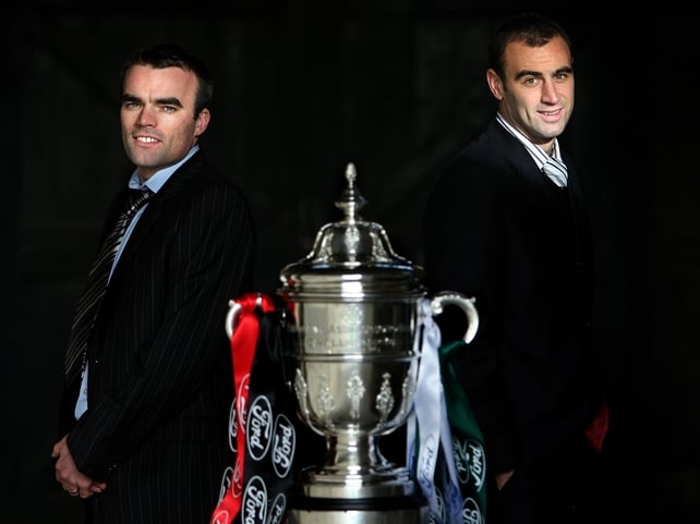 Longford Town Captain Damian Brennan and Cork City's Dan Murray alongside the Cup