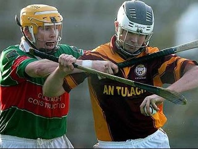 Tulla's Paul Lynch is pursued by Loughmore's Paul Ormond