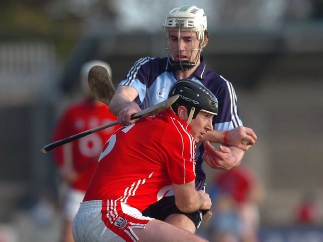 Cork's John Gardiner and Peter Kelly of Dublin get to grips with each other
