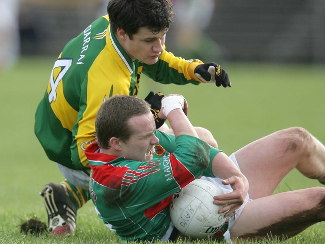 Mayo's Andy Moran gathers possession ahead of Padraig Reidy of Kerry