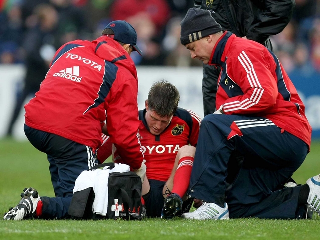 Ronan O'Gara receives medical attention before he was taken off