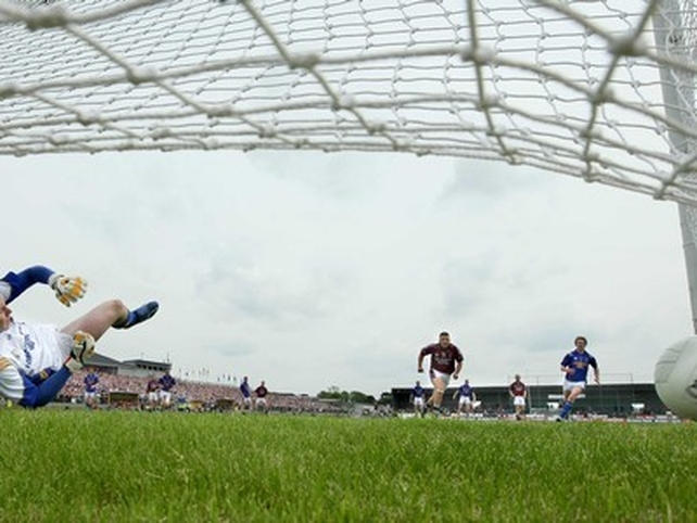 Mangan watches as his first half penalty sends Longford goalkeeper Damien Sheridan the wrong way