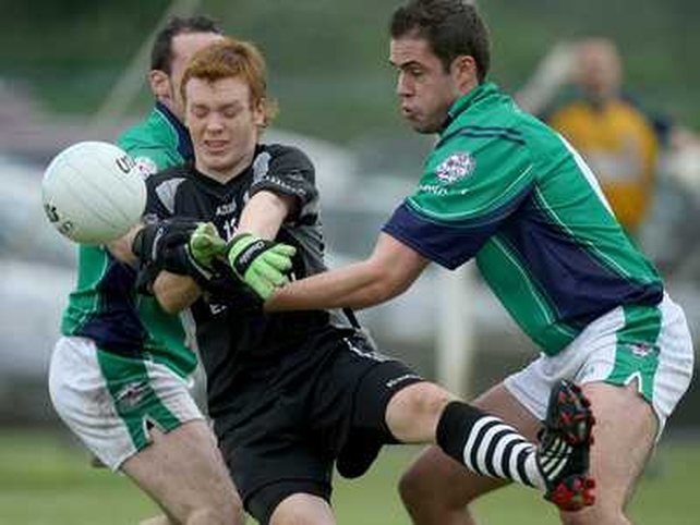 Sligo debutant Gary Gaughan is put under pressure by London's Roger Morgan and Eamon Ó Cuív