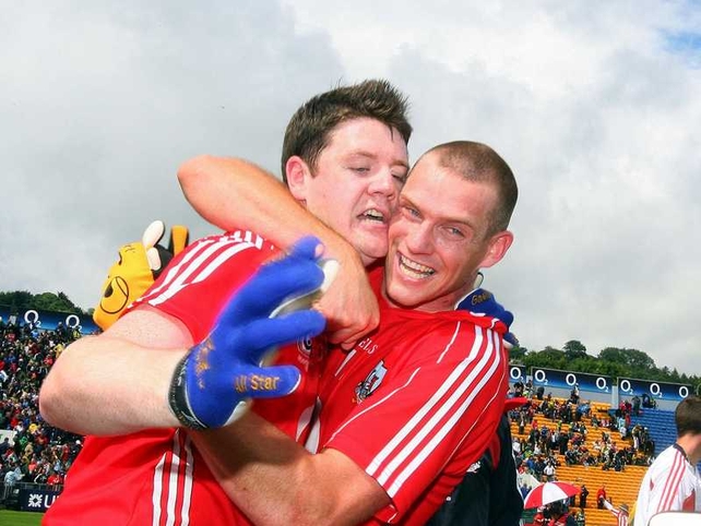 Michael Cussen and Pearse O'Neill celebrate at the final whistle