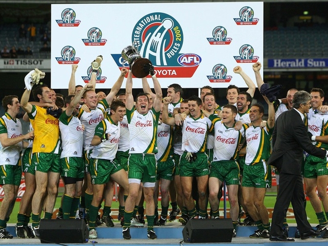 The triumphant Irish team celebrate with the Cormac McAnallen Cup