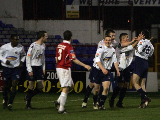 Colin Scanlon is congratulated by his team-mates after scoring the equaliser