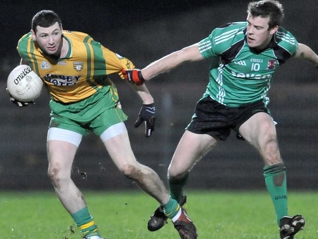 Donegal's Ciaran Bonner and James Loughrey of QUB in action at Healy Park