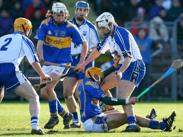 Waterford's Richie Foley and Willie Ryan of Tipperary tussle for possession at Walsh Park