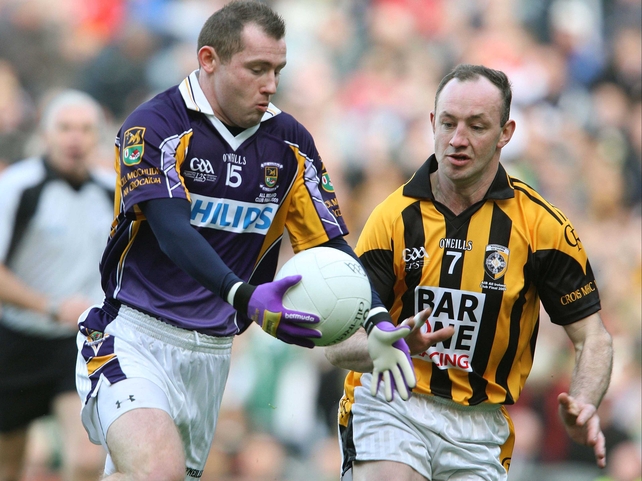 Kilmacud's Pat Burke is challenged by Crossmaglen's John Donaldson