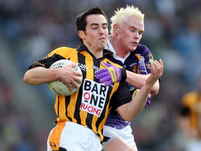Crossmaglen's Aaron Kernan is tracked by Kimacud's Mark Vaughan