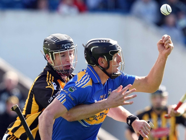 Kilkenny's JJ Delaney gets to grips with Micheál Webster of Tipperary