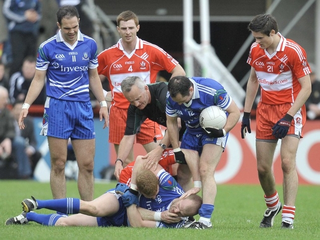 Derry's Fergal Doherty tussles with Monaghan's Dick Clerkin