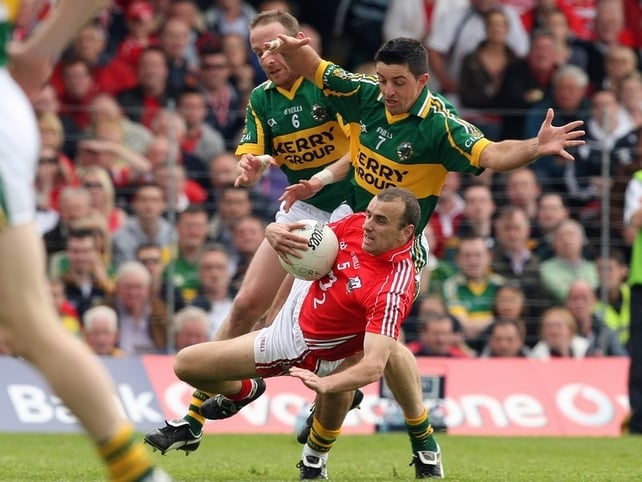 Cork's John Miskella retains possession despite the attentions of Kerry's Tommy Griffin Aidan O'Mahony