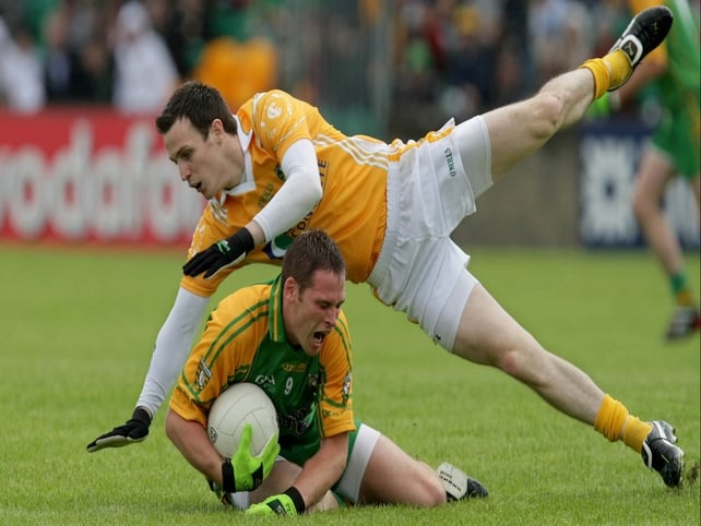 Donegal's Neil Gallagher Antrim's Niall McKeever battle for possession in Ballybofey
