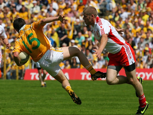 Antrim's Tomas McCann & Tyrone's Kevin Hughes go head to head