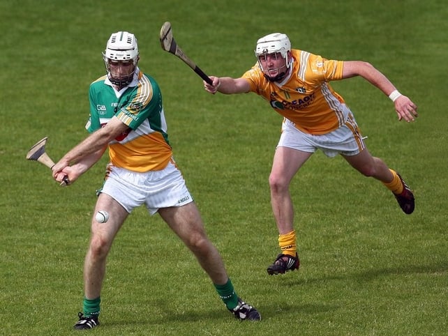 Offaly goalscorer Kevin Brady is challenged by Karl McKeegan of Antrim
