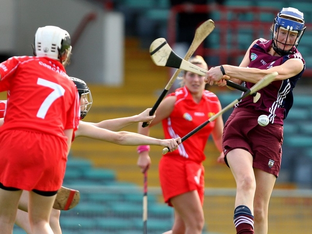 Galway's Caroline Murray clears the ball under pressure