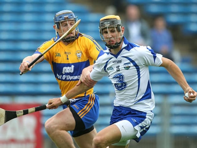 Maurice Shanahan of Waterford with Clare's Conor Cooney in close attention