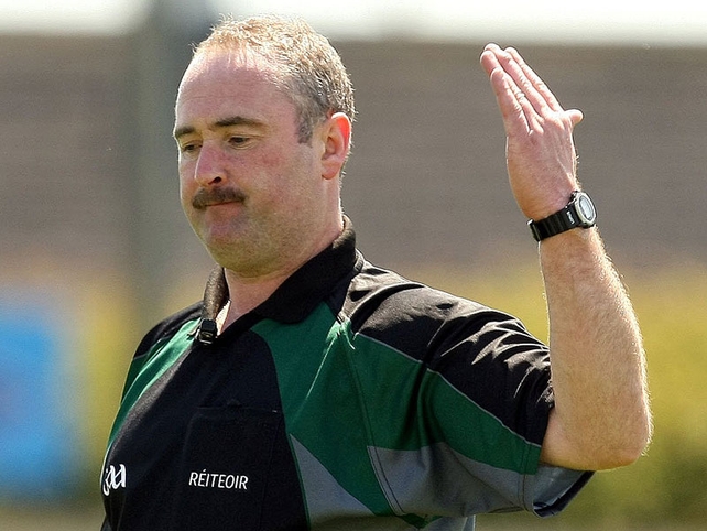 Referee Martin Sludden was struck by spectators as he was escorted off the pitch by Gardai