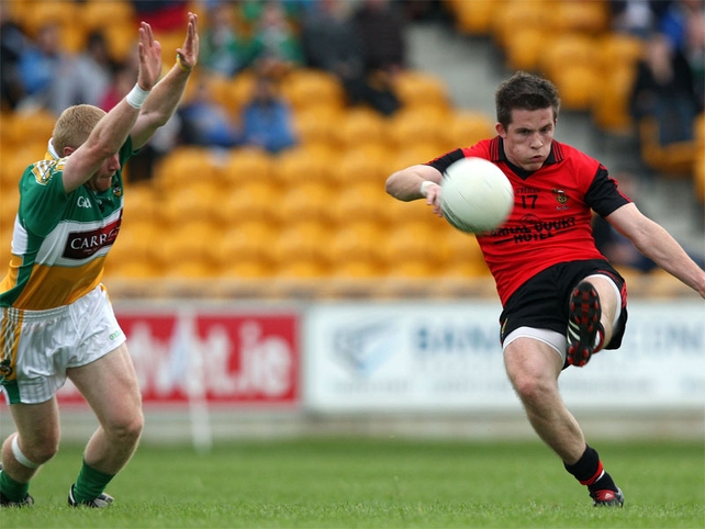 Offaly's Niall Darby attempts to block a goal bound effort from Paul McComiskey at O'Connor Park