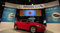 Honda cuts profit target as air bag recalls bite Honda cuts profit target as air bag recalls bite