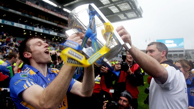 Shane McGrath and Liam Sheedy raise the Liam McCarthy trophy