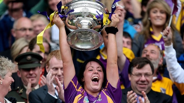 Una Lacey lifts the cup for Wexford