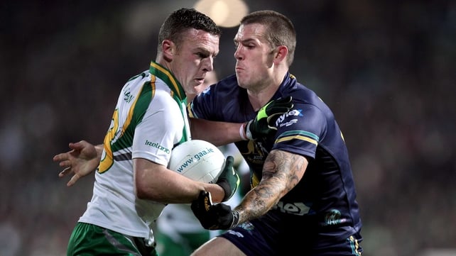 Ireland's Leighton Glynn and Dustin Fletcher of Australia battle for possession at the Gaelic Grounds