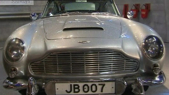 Aston Martin - Comes with machine guns, a bullet-proof shield and tracking device Aston Martin - Comes with machine guns, a bullet-proof shield and tracking device