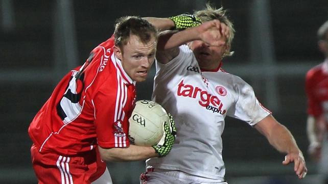 Derry's Martin Donaghy battles Tyrone's Owen Mulligan