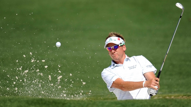 Ian Poulter - the Englishman plays from a bunker during his first round
