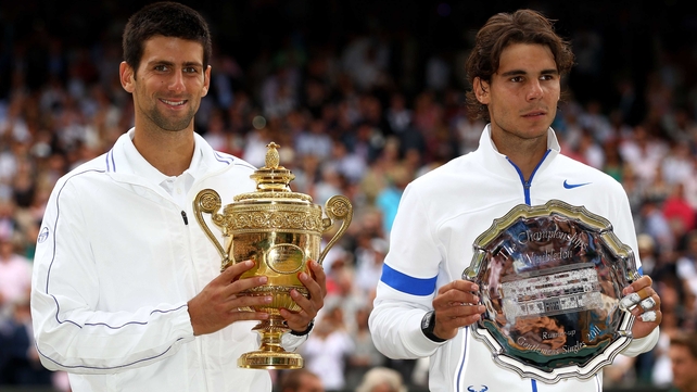 A beaming Novak Djokovic and a dejected Rafael Nadal pose for photos after their final at the All England Club