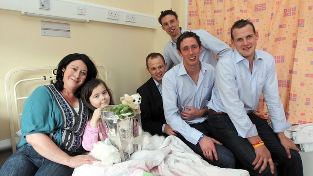 Tommy Walsh, Brian Hogan and JJ Delaney - the Kilkenny players are pictured with Saoirse Mullan and mum Deirdre from Thurles at Crumlin Hospital