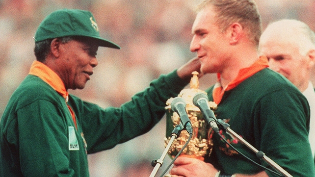 Mandela presenting South Africa captain Francois Pienaar with the World Cup in 1995