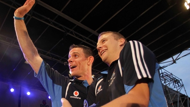 Stephen Cluxton and Tomás Quinn wave to the crowd 