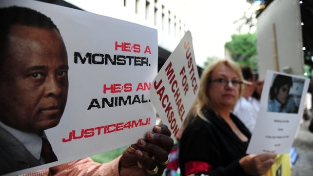 Supporters at the late pop star Michael Jackson hold signs outside Los Angeles Superior Court Supporters at the late pop star Michael Jackson hold signs outside Los Angeles Superior Court