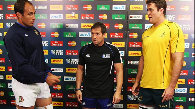 Alain Rolland (centre) pictured with Italy's Sergio Parisse and James Horwill from Australia