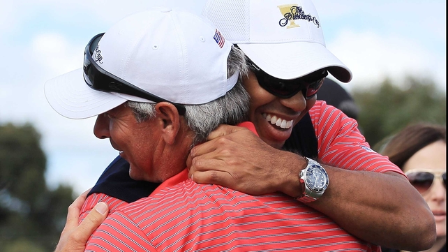 Tiger Woods and Fred Couples embrace after the US sealed victory in the Presidents Cup