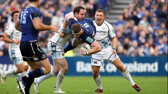 Jamie Heaslip of Leinster keeps possession while tackled by Glasgow's Graeme Morrison