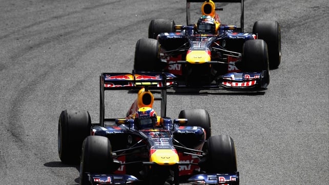 Mark Webber and Sebastian Vettel - Webber passes his team-mate during the race (above)