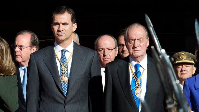 Prince Felipe and King Juan Carlos attend the first parliament session with the new government at the Spanish parliament buildings on 27 December Prince Felipe and King Juan Carlos attend the first parliament session with the new government at the Spanish parliament buildings on 27 December